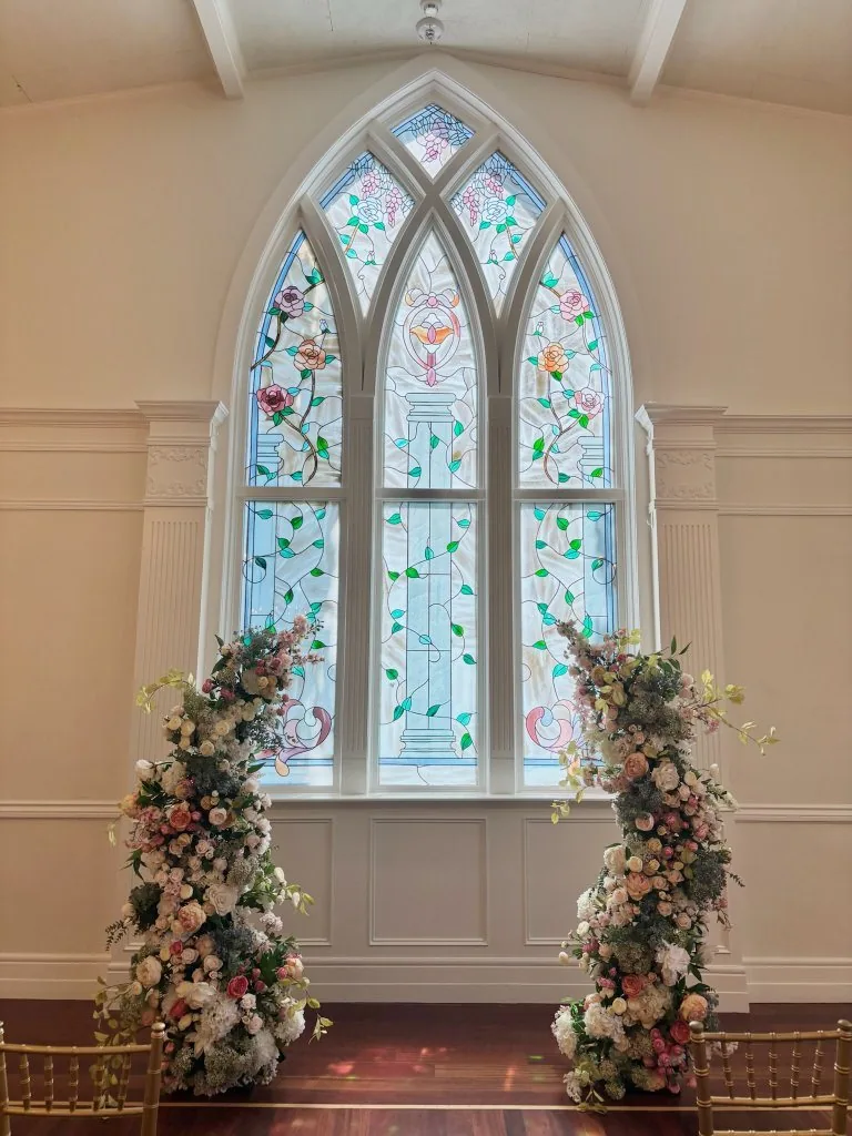 Chapel with stained glass and floral arch